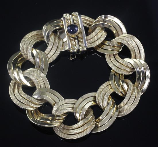 A stylish textured 18ct gold triple band link bracelet, 19.5cm.